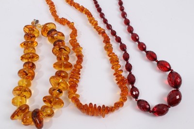 Lot 856 - Amber bead necklace, one other necklace, vintage simulated cherry amber faceted bead necklace and three bracelets