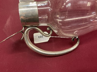 Lot 203 - Edwardian silver mounted glass claret jug