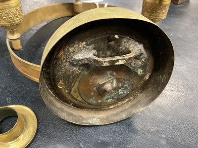 Lot 742 - Pair of Empire bronze and ormolu three light wall appliqués, with lion mask boss wall mount supporting tooled projecting ring with three sconces, 19cm wide