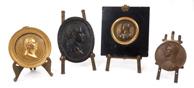 Lot 756 - 19th century gilt metal portrait relief plaque depicting Frederick I of Wuttemburg, by Galle, trade label to reverse, in glazed gilt frame, 9cm diameter, raised on miniature easel, together with Gr...