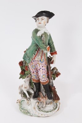 Lot 92 - A Derby figure of a sportsman with a dog - unusual red anchor mark