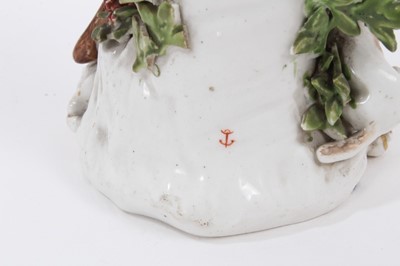 Lot 14 - A Derby figure of a sportsman with a dog - unusual red anchor mark