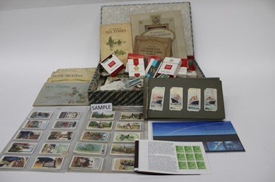 Lot 1493 - Cigarette cards and trade cards in albums and loose, mostly 1930s period, plus some stamps and PHQ cards.