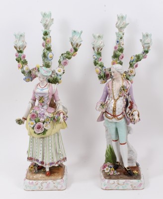 Lot 22 - Pair of Meissen style porcelain figural candlesticks