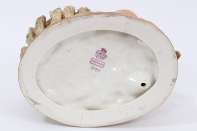Lot 43 - Royal Worcester blush ivory figural basket