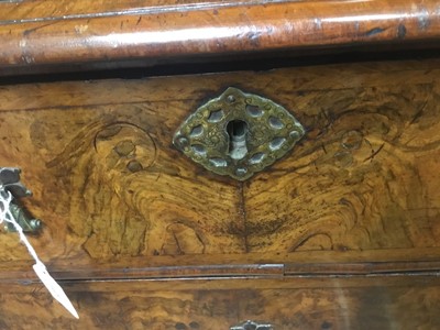 Lot 1404 - Early 18th century walnut veneered secretaire chest on chest, the top with frieze drawer, fitted interior with pigeon holes and drawers enclosed by two doors, the base with two short and two long d...