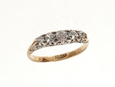 Lot 448 - Late Victorian diamond five stone ring with five graduated old cut diamonds in carved gold setting on 18ct gold shank