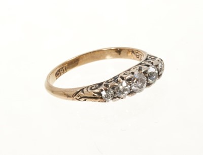 Lot 448 - Late Victorian diamond five stone ring with five graduated old cut diamonds in carved gold setting on 18ct gold shank