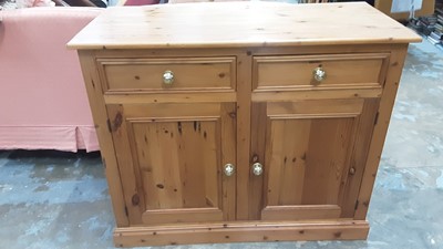 Lot 1010 - Modern pine dresser base with twin drawers above twin cupboards below, together with a smaller matching example (2)