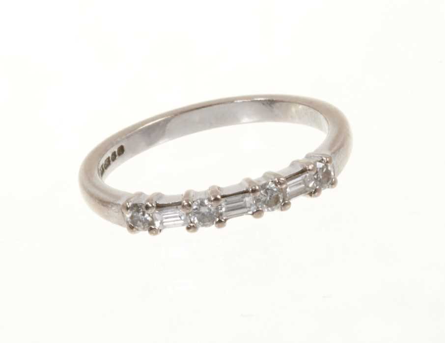 Lot 444 - Diamond eternity ring with a half hoop of brilliant cut and baguette cut diamonds in 18ct white gold setting