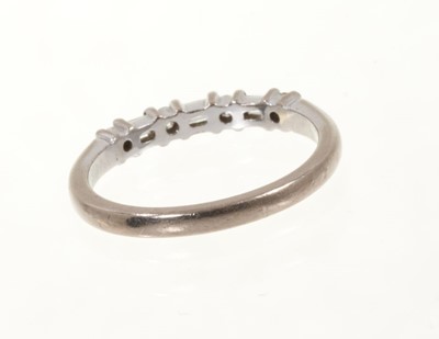 Lot 444 - Diamond eternity ring with a half hoop of brilliant cut and baguette cut diamonds in 18ct white gold setting