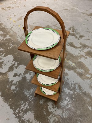 Lot 122 - Art Deco walnut plate stand and suite of dishes