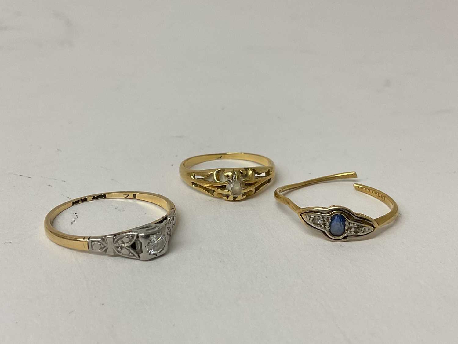 Lot 93 - 18ct gold diamond single stone ring, ring size Q, another 18ct gold diamond single stone ring, ring size L and an 18ct gold gem set dress ring (3).