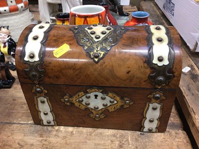 Lot 51 - Victorian Gothic walnut dome topped tea caddy, with ivory and engraved gilt metal mounts. The hinged cover enclosing twin lidded compartments. With key