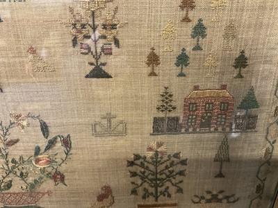 Lot 792 - George IV needlework sampler, by Elizabeth Sandland Aged 14, 1823. A prayer above houses and trees with birds, dog and a large central pot of flowers, all within an acorn border. Gilt frame