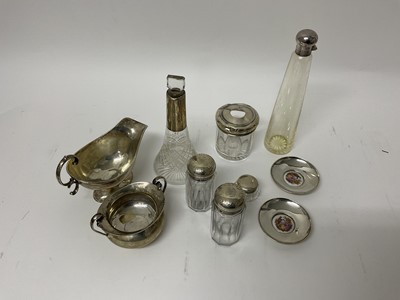 Lot 810 - Silver sauce boat, two handled silver sugar bowl, pair of silver pin dishes and selection of silver topped glass jars/bottles