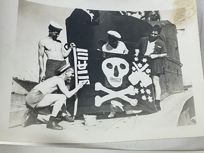 Lot 501 - Collection of twenty four Second World War Naval photographs to include sailors by a Jolly Rodger, ariel dog fights and others.