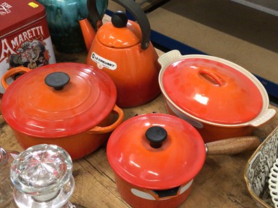 Lot 24 - Group of Le Creuset volcano orange kettle and pans