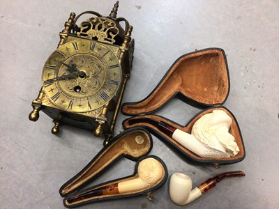 Lot 343 - Three cased meerschaum pipes, together with a 17th century style brass lantern clock