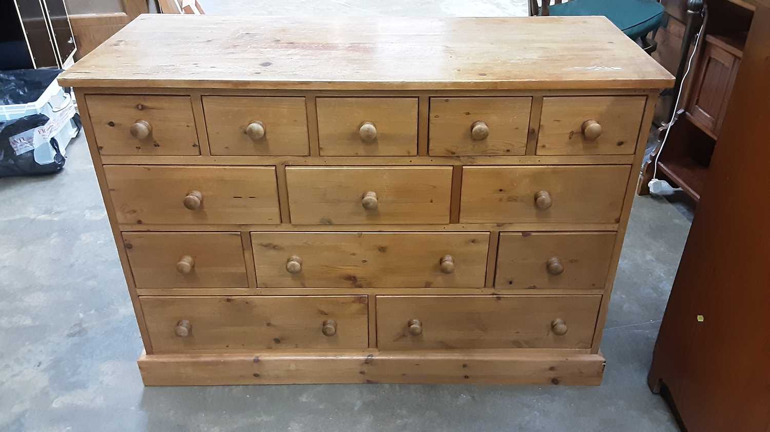 Lot 1023 - Contemporary pine chest with an arrangement of drawers, 120cm wide, 48.5cm deep, 83cm high