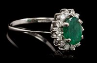 Lot 409 - Emerald and diamond cluster ring, the oval...