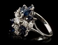 Lot 410 - Sapphire and diamond cocktail ring, the...