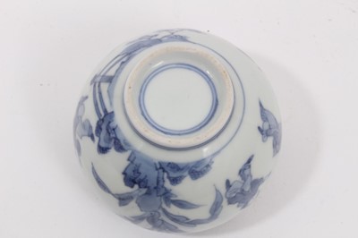 Lot 11 - A Chinese blue and white small porcelain bowl, probably early 20th century, painted with figures and landscapes, double ring mark to base