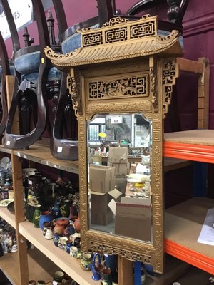 Lot 655 - 1950s Chinese giltwood mirror with architectural frame