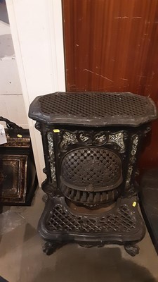 Lot 1173 - Antique French cast iron and pottery mounted stove