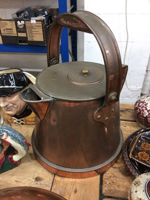 Lot 33 - Large copper riveted jug with swing handle, a copper and brass pan, and a plated dish (3)