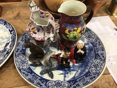 Lot 38 - Two Delft dishes, two Royal Doulton Dickens figures and a Doulton jug, a Rosenthal Sea Lion and other items