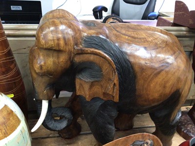 Lot 39 - A large carved wood model of an elephant, together with African carvings, vases, etc
