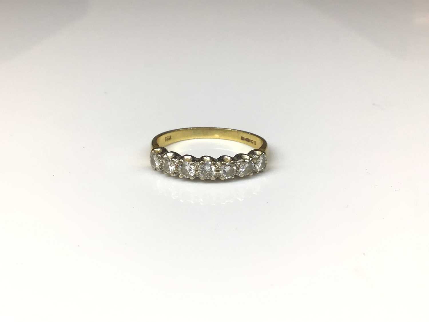 Lot 116 - 18ct gold diamond seven stone ring