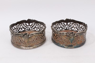 Lot 709 - Pair of 19th century pierced silver plated wine coasters