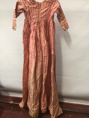 Lot 2050 - Late 18th century / early 19th century Regency pink striped silk open skirt dress with high waist and  cross front and pleated back.