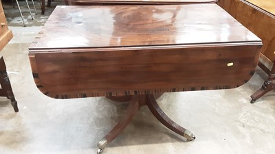 Lot 1036 - Good quality Regency mahogany Pembroke table with rosewood cross banded decoration , end drawer with brass lions head handles on turned colomn on four reeded splayed legs on brass paw castors 99 cm...