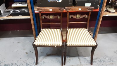 Lot 1037 - Pair handsome Regency simulated rosewood dining chairs with gilt metal mounts on sabre legs  .