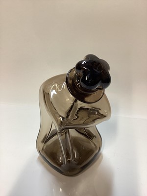 Lot 1102 - Holmegaard smoky grey kluk kluk decanter with crown stopper, designed by Jakob Bang