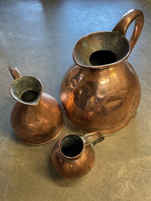 Lot 179 - Two gallon copper jug and two smaller