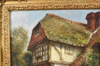 Lot 1199 - Frank Moss Bennett (1874-1952) a pair, oil on board - figures and timbered cottages, both signed and dated 1917, 35cm x 24.5cm, in ornate gilt frames (2)