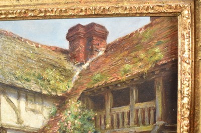 Lot 1199 - Frank Moss Bennett (1874-1952) a pair, oil on board - figures and timbered cottages, both signed and dated 1917, 35cm x 24.5cm, in ornate gilt frames (2)