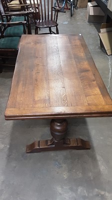 Lot 1068 - Seventeenth century style carved oak draw leaf dining table on bulbous cup and cover supports joined by stretcher, opening to 242cm x 84cm