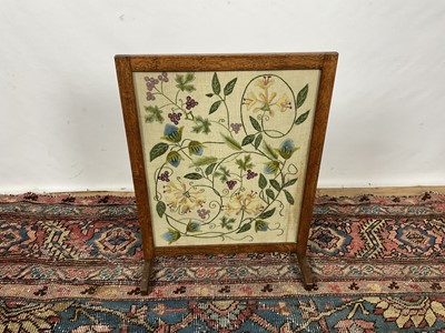 Lot 1161 - Arts and crafts oak crewel work embroidered fire screen