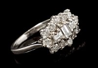 Lot 436 - Diamond cluster ring, the three central step...