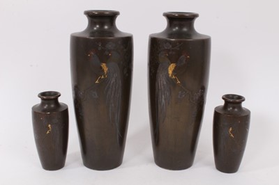 Lot 701 - Two pairs of early 20th century Japanese mixed metal slender vases