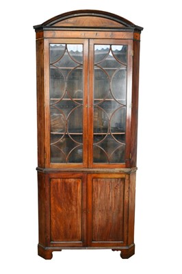 Lot 1394 - George III mahogany floorstanding two height corner cupboard