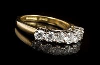 Lot 439 - Diamond seven stone eternity ring with seven...