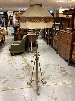 Lot 1055 - Edwardian brass oil lamp standard converted to electricity with Egyptian-style decoration and lions head feet 166 cm