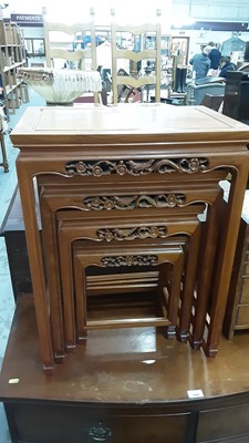 Lot 1076 - Nest of four Chinese carved hardwood occasional tables