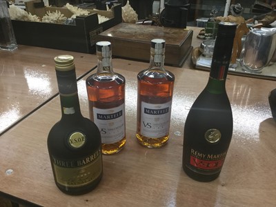 Lot 450 - Cognac and Brandy- two 70cl bottles of Martel VS single distillery cognac, together with a 70cl bottle of Remy Martin Cognac fine champagne and a 68cl bottle of Three Barrels brandy (4)